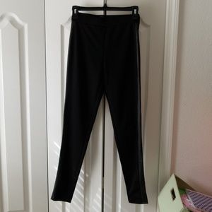 Black stretch pants with faux leather side trim